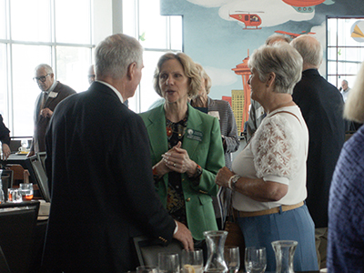 ChiefJusticeDebraStephenschatswithattendeesattheWashingtonStateBarAssociations50-yearMemberLuncheonattheMuseumofFlightinSeattleJune62025