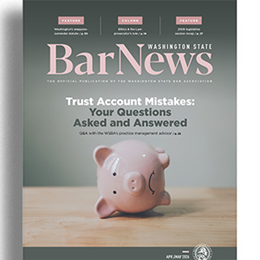 Cover of April 2026 Bar News showing a toppled piggy bank